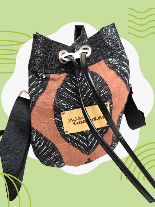 Sac seau tissu feuille noir fond terracotta cuir vegan noir